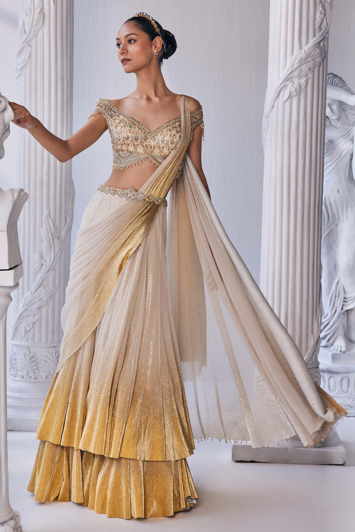 Buy Pleated Foil Drape Lehenga Set by Mandira Wirk
